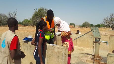 Staff Of  The Agence De L’Eau Du Gourma (AEG) Is Taking A Water Quality Sample At One Of The Water Resources Using The Akvo Cassifly Tool