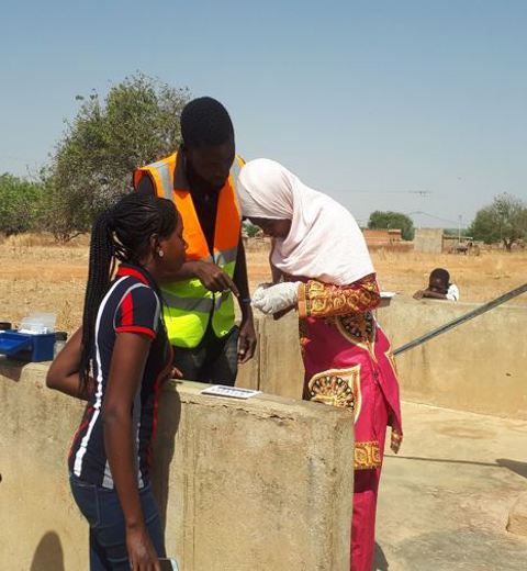 Staff Of  The Agence De L’Eau Du Gourma (AEG) Is Taking A Water Quality Sample At One Of The Water Resources Using The Akvo Cassifly Tool