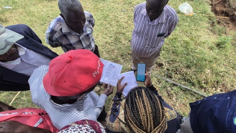 group of citizen scientist entering data into Kobo Collect application